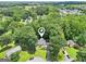 Aerial view of home nestled in a lush, green landscape, pin-pointed location, and neighborhood setting at 345 Sharon Dr, Fayetteville, GA 30214