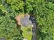 Overhead shot of a cozy home with a lush, green canopy of trees, demonstrating privacy and nature's beauty at 345 Sharon Dr, Fayetteville, GA 30214