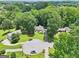 Aerial view of house situated in a neighborhood with tree-lined streets, showcasing the community and location at 345 Sharon Dr, Fayetteville, GA 30214