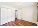 Bedroom featuring hardwood floors, closet, and bright window views at 345 Sharon Dr, Fayetteville, GA 30214