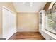 Bedroom with hardwood floors, built-in shelving, window seat, closet, and ceiling fan at 345 Sharon Dr, Fayetteville, GA 30214