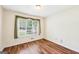 Bedroom with hardwood floors and a bright window view at 345 Sharon Dr, Fayetteville, GA 30214