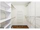 Walk-in closet featuring adjustable shelving and rod system for optimal storage solutions at 345 Sharon Dr, Fayetteville, GA 30214