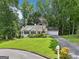 Charming single-story home with a well-manicured lawn, driveway, and inviting curb appeal at 345 Sharon Dr, Fayetteville, GA 30214