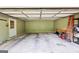 Spacious garage with ample storage, ladder, and utility access, providing parking and organizational solutions at 345 Sharon Dr, Fayetteville, GA 30214