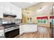 Kitchen with island and stainless steel oven range, showcasing an open-concept living space at 345 Sharon Dr, Fayetteville, GA 30214