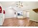 Bright, open living area with hardwood floors, vaulted ceiling, and an open view to the kitchen at 345 Sharon Dr, Fayetteville, GA 30214
