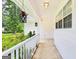 Charming covered porch with decorative hanging lanterns and tiled flooring at 345 Sharon Dr, Fayetteville, GA 30214