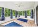 Inviting screened porch offers serene views of the surrounding greenery at 345 Sharon Dr, Fayetteville, GA 30214