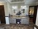 Bathroom vanity with double sinks, granite counters, and decorative vase at 3970 Governors Cir, Loganville, GA 30052