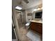 Tiled bathroom features a glass-enclosed shower, vanity, and toilet in a well-lit space at 3970 Governors Cir, Loganville, GA 30052
