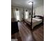 This bedroom showcases hardwood floors and natural light from the window at 3970 Governors Cir, Loganville, GA 30052