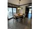 This charming dining area features tile floors, a wooden table, and access to a sunroom at 3970 Governors Cir, Loganville, GA 30052