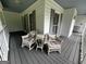Front porch with seating, perfect for enjoying peaceful moments outdoors at 3970 Governors Cir, Loganville, GA 30052