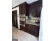 This kitchen offers stainless steel appliances and granite countertops with tile backsplash at 3970 Governors Cir, Loganville, GA 30052