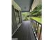 Relaxing front porch offers views of the lush landscaped yard at 3970 Governors Cir, Loganville, GA 30052