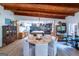 Inviting dining area with modern lighting, wood flooring, and seamless transition to the kitchen and living spaces at 8815 Campbellton St, Douglasville, GA 30134