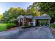 Brick home with a covered driveway and carport area at 8815 Campbellton St, Douglasville, GA 30134