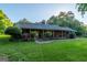 Classic brick ranch-style home with a welcoming front porch and meticulously maintained landscaping at 8815 Campbellton St, Douglasville, GA 30134