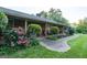 Inviting front porch with colorful landscaping and a brick facade at 8815 Campbellton St, Douglasville, GA 30134