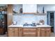 Gourmet kitchen featuring stone countertops, custom cabinetry, stainless steel appliances, and modern fixtures at 8815 Campbellton St, Douglasville, GA 30134