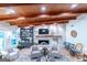 Bright living room showcasing a stone fireplace, built-in shelving, and comfortable seating with natural light at 8815 Campbellton St, Douglasville, GA 30134
