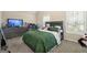 Spacious bedroom featuring a plush bed, a window, and a TV at 2277 Church St, Hampton, GA 30228