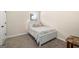 Bright bedroom featuring a twin bed, a window, and carpet flooring at 2277 Church St, Hampton, GA 30228