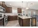 Modern kitchen featuring stainless steel appliances, granite countertops, and a central island at 2277 Church St, Hampton, GA 30228