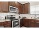 Kitchen with stainless steel appliances, granite countertops, and stylish cabinetry at 2277 Church St, Hampton, GA 30228