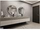 This bathroom features modern countertops, a gray wall, and dual sinks at 3181 Buck Branch Rd, Conyers, GA 30094