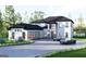 Stunning modern home with a spacious driveway, lush landscaping, and an attached two car garage at 3181 Buck Branch Rd, Conyers, GA 30094