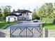 Beautiful modern home with mature trees, lush landscaping and a gated entry at 3181 Buck Branch Rd, Conyers, GA 30094