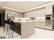 This kitchen features stone countertops, modern appliances, and an eat-in island at 3181 Buck Branch Rd, Conyers, GA 30094