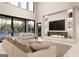 Open-concept living room boasting soaring ceilings, a modern fireplace, and expansive windows overlooking the pool at 3181 Buck Branch Rd, Conyers, GA 30094