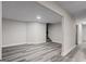 Finished basement with gray-toned flooring, neutral paint and access to stairs at 5368 Nw Stafford Nw Dr, Lilburn, GA 30047