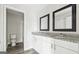 Bright bathroom features double sink vanity with granite countertop and updated fixtures at 5368 Nw Stafford Nw Dr, Lilburn, GA 30047