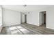 Bright bedroom boasts neutral walls and gray wood-look floors, leading to an ensuite bathroom for added convenience at 5368 Nw Stafford Nw Dr, Lilburn, GA 30047