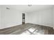 This spacious bedroom features modern gray flooring and neutral walls, creating a serene and inviting atmosphere at 5368 Nw Stafford Nw Dr, Lilburn, GA 30047