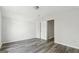 Neutral bedroom with wood-look floors, new paint, closet and natural light at 5368 Nw Stafford Nw Dr, Lilburn, GA 30047