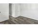 Clean bedroom space featuring wood-look floors, neutral paint, closet and natural light at 5368 Nw Stafford Nw Dr, Lilburn, GA 30047