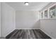 Cozy bedroom has neutral paint, bright windows and wood-look flooring at 5368 Nw Stafford Nw Dr, Lilburn, GA 30047