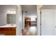 Interior view highlighting a bathroom with a shower and vanity, connecting to a kitchen with wood cabinets and countertops at 104 Conway St, Peachtree City, GA 30269