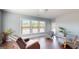 Sun-drenched seating area, featuring hardwood floors and many windows at 104 Conway St, Peachtree City, GA 30269