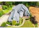 Aerial view of a well-maintained, two-story home surrounded by mature trees and landscaping at 204 Pinehurst Way, Carrollton, GA 30116