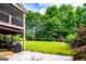 View of the backyard, covered deck, and patio at 204 Pinehurst Way, Carrollton, GA 30116