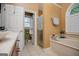 Bathroom with a soaking tub, shower with a glass door, and walk-in closet, showcasing functionality at 204 Pinehurst Way, Carrollton, GA 30116