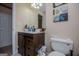 Bathroom featuring a single sink with drawers and cabinets, a toilet and tile floors at 204 Pinehurst Way, Carrollton, GA 30116