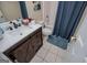 Bathroom featuring a single sink with drawers and cabinets, a toilet, a tub and shower at 204 Pinehurst Way, Carrollton, GA 30116
