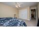 Bedroom featuring a double bed, light yellow walls, carpet, and large closet doors at 204 Pinehurst Way, Carrollton, GA 30116